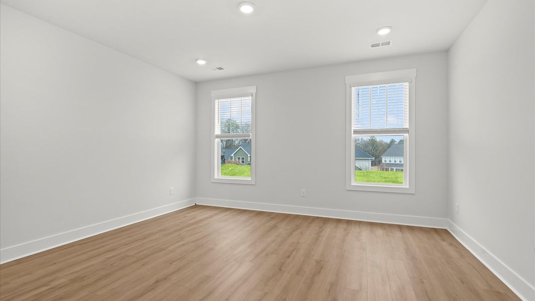 First-class hardwood floors and tasteful finishes elevate the private retreat of this exceptional primary suite First-class hardwood floors and tasteful finishes elevate the private retreat of this exceptional primary suite