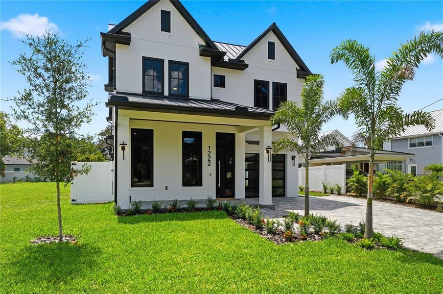 Front exterior of a new home in , Orlando, FL, highlighting curb appeal (Image 23). Front exterior of a new home in , Orlando, FL, highlighting curb appeal (Image 23).