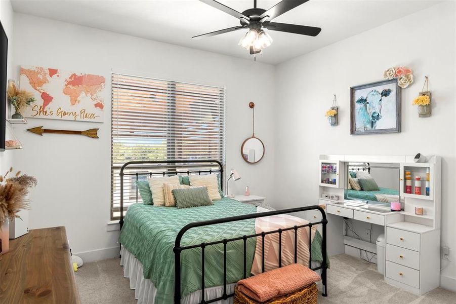 Bedroom featuring  carpet and ceiling fan.