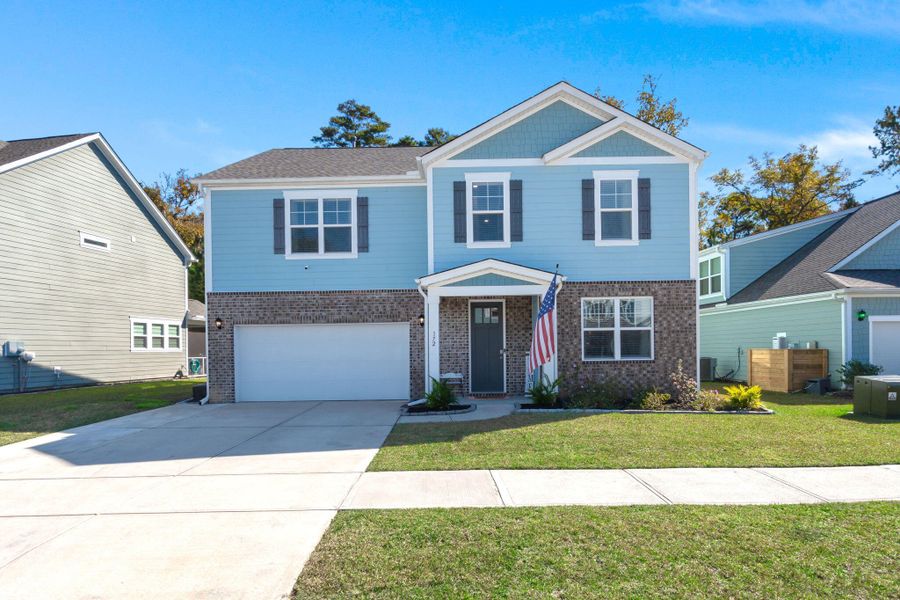 Front exterior of a new home in The Ponds, Summerville, SC, highlighting curb appeal (Image 2). Front exterior of a new home in The Ponds, Summerville, SC, highlighting curb appeal (Image 2).