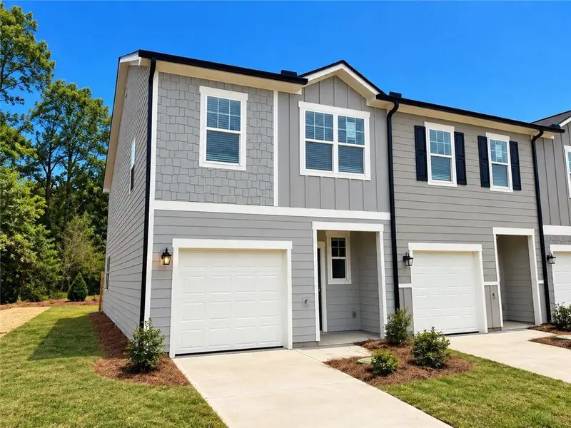 Front exterior of a new home in Villas at Cassville, Cartersville, GA, highlighting curb appeal (Image 2). Front exterior of a new home in Villas at Cassville, Cartersville, GA, highlighting curb appeal (Image 2).