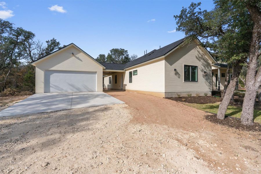 Ranch-style house with driveway and an attached garage Ranch-style house with driveway and an attached garage