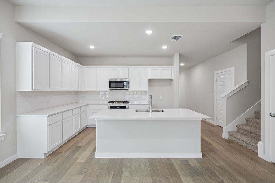 Kitchen in the Stanley II home plan by Trophy Signature Homes – REPRESENTATIVE PHOTO