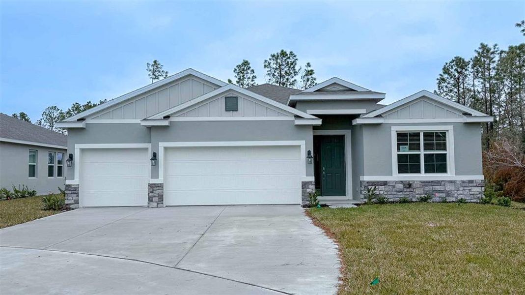 Front exterior of a new home in Archers Mill, Ormond Beach, FL, highlighting curb appeal (Image 1). Front exterior of a new home in Archers Mill, Ormond Beach, FL, highlighting curb appeal (Image 1).