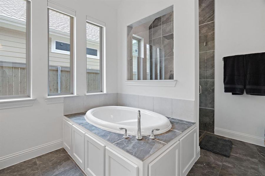 Separate tub, shower and double vanities make this primary bathroom as showstopper! Separate tub, shower and double vanities make this primary bathroom as showstopper!