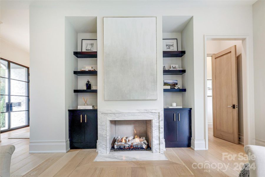 Calacatta marble fireplace with built-ins