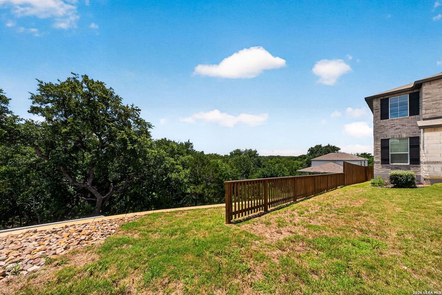 Exterior details and patio area of a home in Thomas Pond, San Antonio (Image 32).