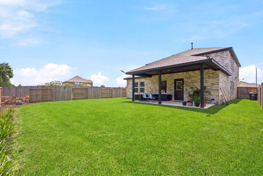 Exterior details and patio area of a home in Massey Oaks, Pearland (Image 29).