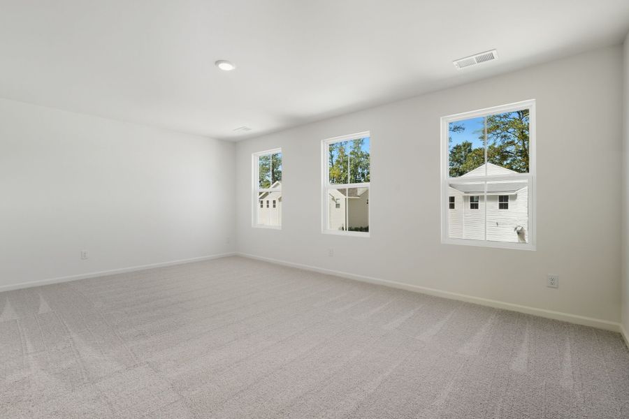 A room with a few paintings on the wall.