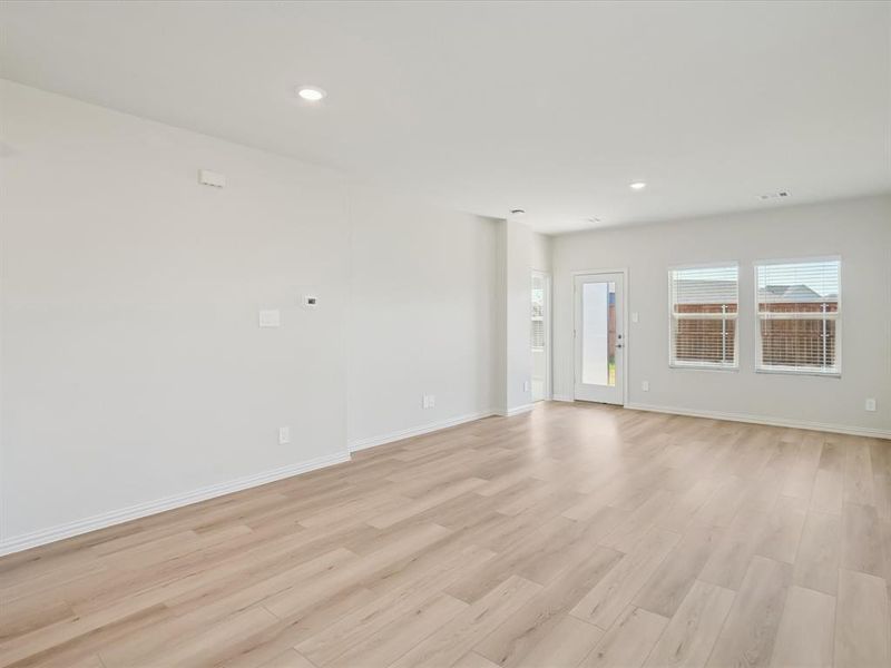 Spare room featuring light wood-type flooring and recessed lighting