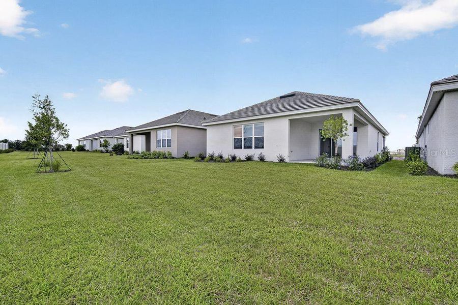 Exterior details and patio area of a home in Coasterra Community Group Page, Palmetto (Image 18).