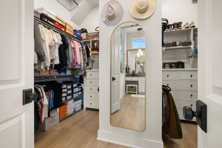 Generous walk-in closet with ample storage and organization space.