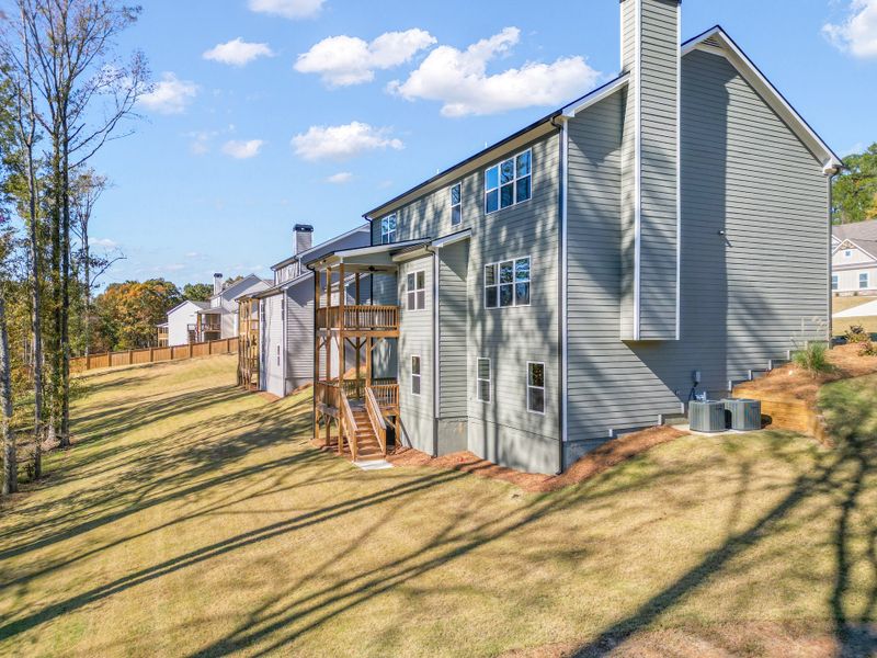 Exterior details and patio area of a home in Woodland Hills, Loganville (Image 15).
