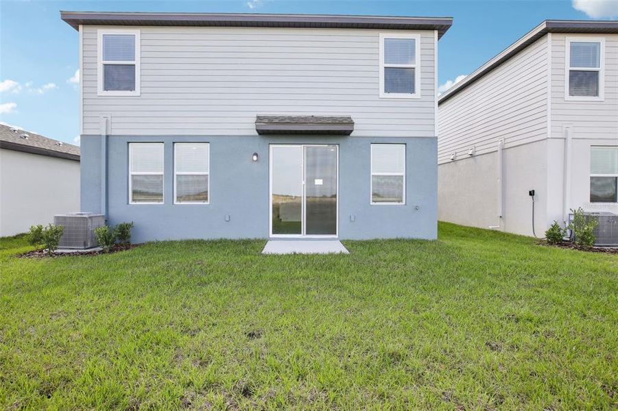Front exterior of a new home in Benton Hills - Premier Series, Brooksville, FL, highlighting curb appeal (Image 2). Front exterior of a new home in Benton Hills - Premier Series, Brooksville, FL, highlighting curb appeal (Image 2).