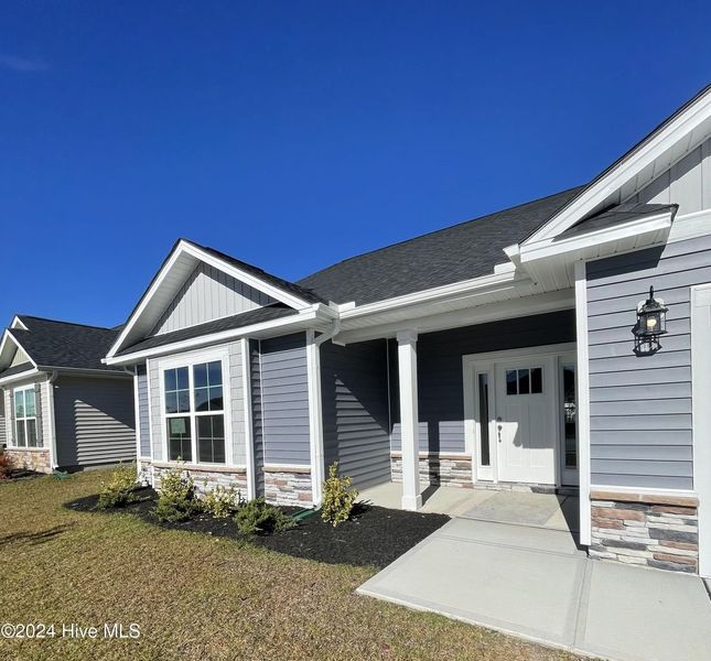 Front exterior of a new home in Athens Acres, New Bern, NC, highlighting curb appeal (Image 2). Front exterior of a new home in Athens Acres, New Bern, NC, highlighting curb appeal (Image 2).