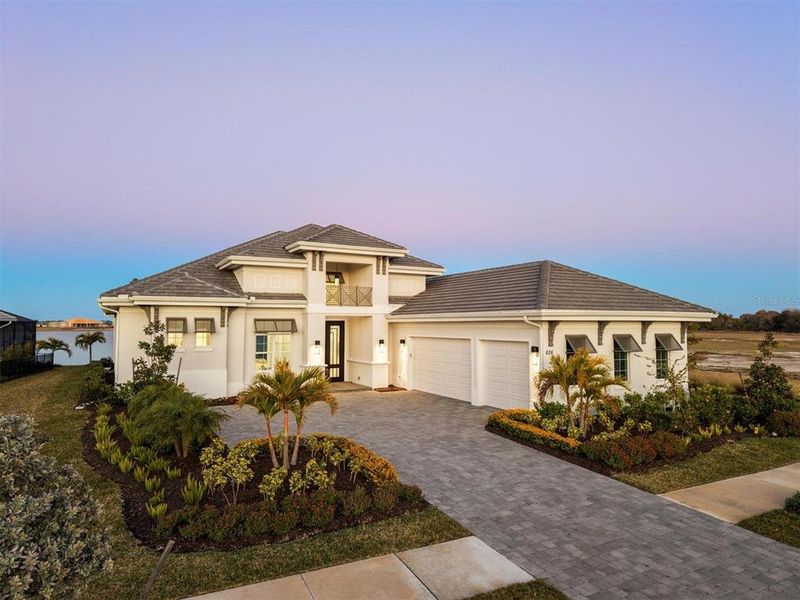 Front exterior of a new home in , Sarasota, FL, highlighting curb appeal (Image 1). Front exterior of a new home in , Sarasota, FL, highlighting curb appeal (Image 1).