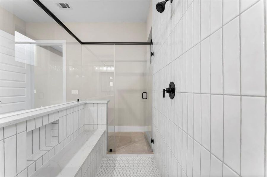 Expansive walk-through shower for a luxurious bathing experience.