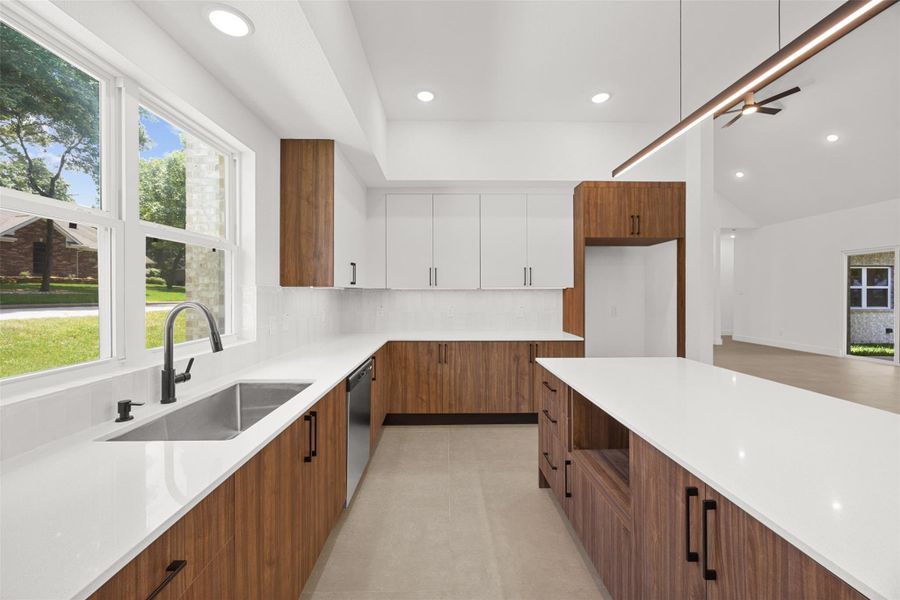 Kitchen with abundant storage, soft-close cabinetry, and a large workstation sink.
