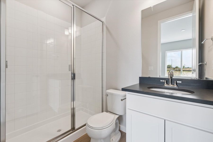 A bathroom with a glass shower.