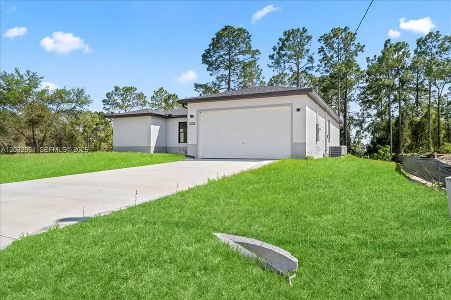 Front exterior of a new home in , Lehigh Acres, FL, highlighting curb appeal (Image 1). Front exterior of a new home in , Lehigh Acres, FL, highlighting curb appeal (Image 1).