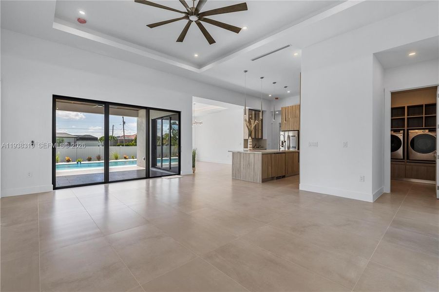 The contemporary living room features clean lines, modern finishes, and an open layout designed for comfort and everyday living.