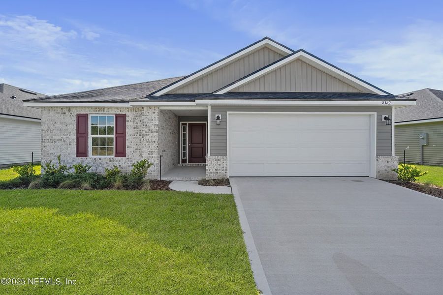 Front exterior of a new home in Summerglen, Jacksonville, FL, highlighting curb appeal (Image 15). Front exterior of a new home in Summerglen, Jacksonville, FL, highlighting curb appeal (Image 15).