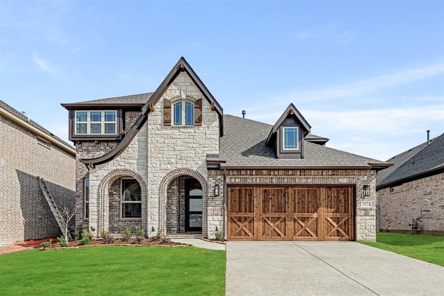 Front exterior of a new home in Painted Tree Woodland District 50, McKinney, TX, highlighting curb appeal (Image 1).