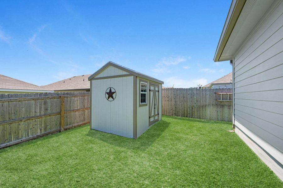 Exterior details and patio area of a home in Liberty Village, Brenham (Image 25).