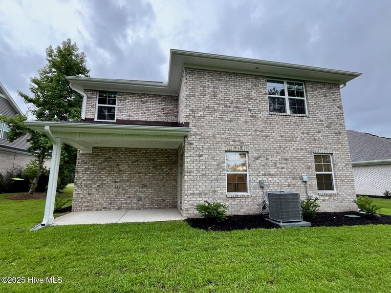 Front exterior of a new home in Palmetto Creek, Bolivia, NC, highlighting curb appeal (Image 2). Front exterior of a new home in Palmetto Creek, Bolivia, NC, highlighting curb appeal (Image 2).