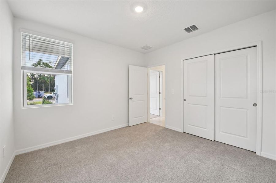 Spacious, unfurnished interior of a new home in Ridgehaven - Villas, Ormond Beach (Image 25).