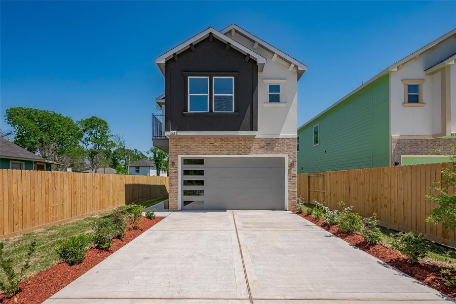 Front exterior of a new home in , Houston, TX, highlighting curb appeal (Image 1).