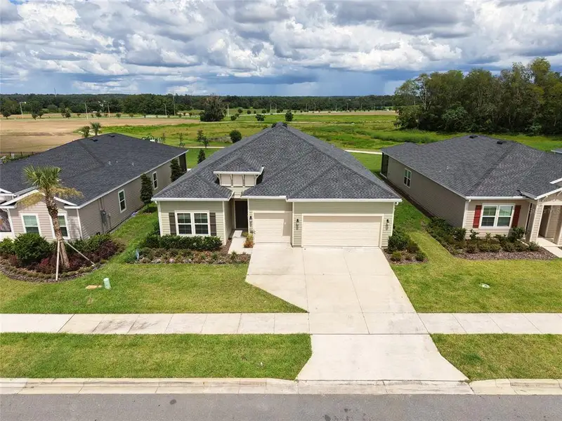 Front exterior of a new home in , Alachua, FL, highlighting curb appeal (Image 1). Front exterior of a new home in , Alachua, FL, highlighting curb appeal (Image 1).