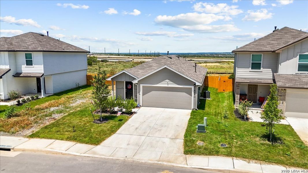 Front exterior of a new home in Redbird Ranch, San Antonio, TX, highlighting curb appeal (Image 26). Front exterior of a new home in Redbird Ranch, San Antonio, TX, highlighting curb appeal (Image 26).