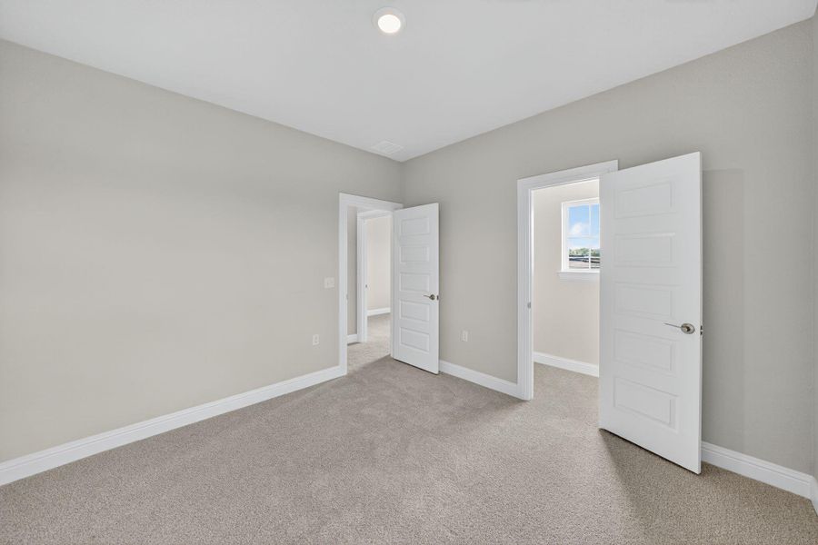 Unfurnished bedroom featuring light colored carpet and recessed lighting Unfurnished bedroom featuring light colored carpet and recessed lighting