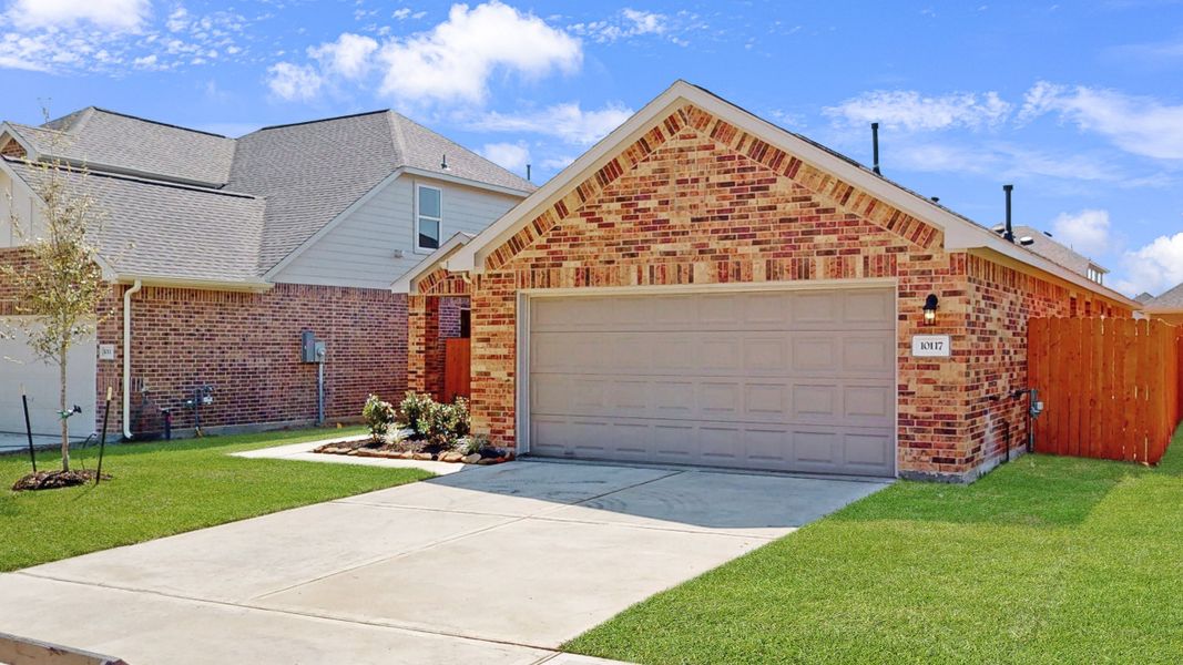 Representative exterior photo of a completed home built from the Floor Plan 1605 by Colina Homes in River Ranch, Dayton, TX (Image 20).