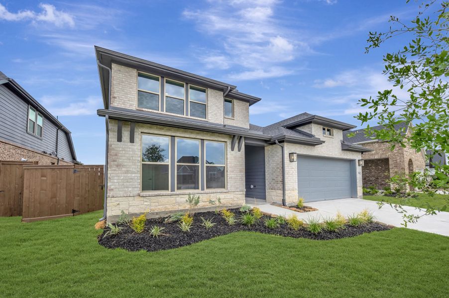 Front exterior of a new home in Beacon Point at Lago Mar - Retreat Collection, Texas City, TX, highlighting curb appeal (Image 22).
