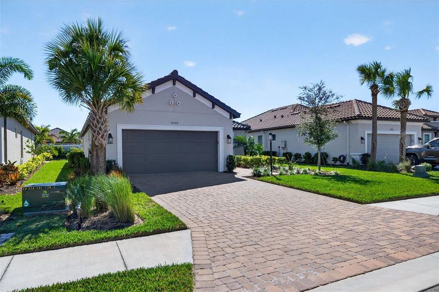 Front exterior of a new home in , Bradenton, FL, highlighting curb appeal (Image 24).