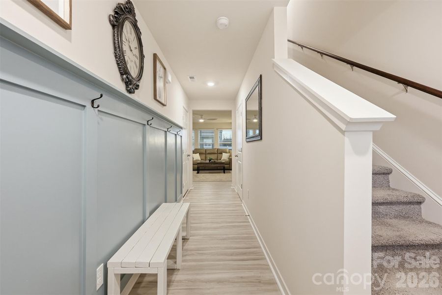 front entrance- board and baton trim detail -upgrade added after purchase!, power room, garage, stair access