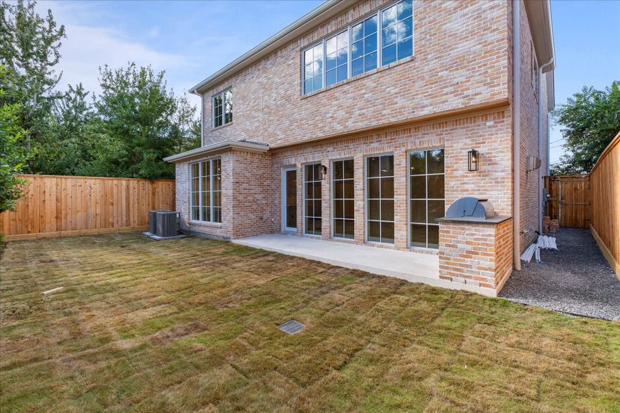 Backyard with outdoor kitchen.