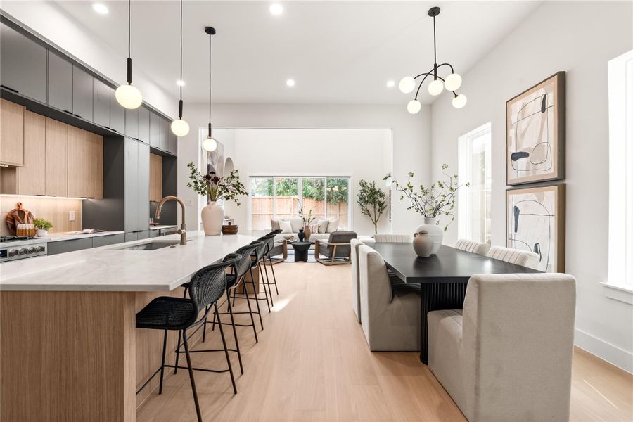 This oversized kitchen features luxury Bosch appliances, Taj Mahal counters, and more than enough storage space with three layers of European soft close cabinetry. This oversized kitchen features luxury Bosch appliances, Taj Mahal counters, and more than enough storage space with three layers of European soft close cabinetry.