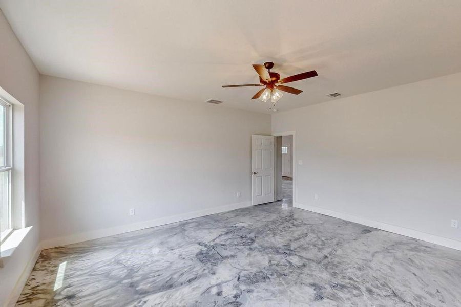 Unfurnished room with ceiling fan