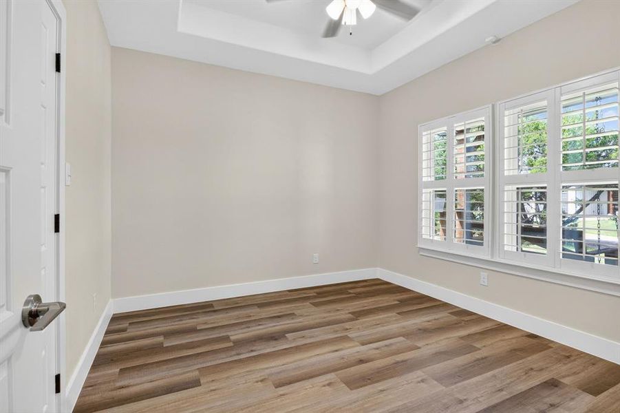 Front spare bedroom overlooking the front porch, plantation shutters and widow treatment throughout the house, with plenty of lightning and tray box ceilings for better feeling of space in each room. Semi gloss paint throughout the house and easier for cleaning.