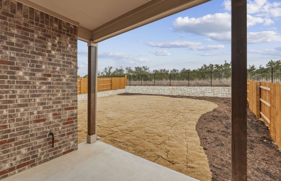 Exterior details and patio area of a home in West Cypress Hills, Spicewood (Image 31).
