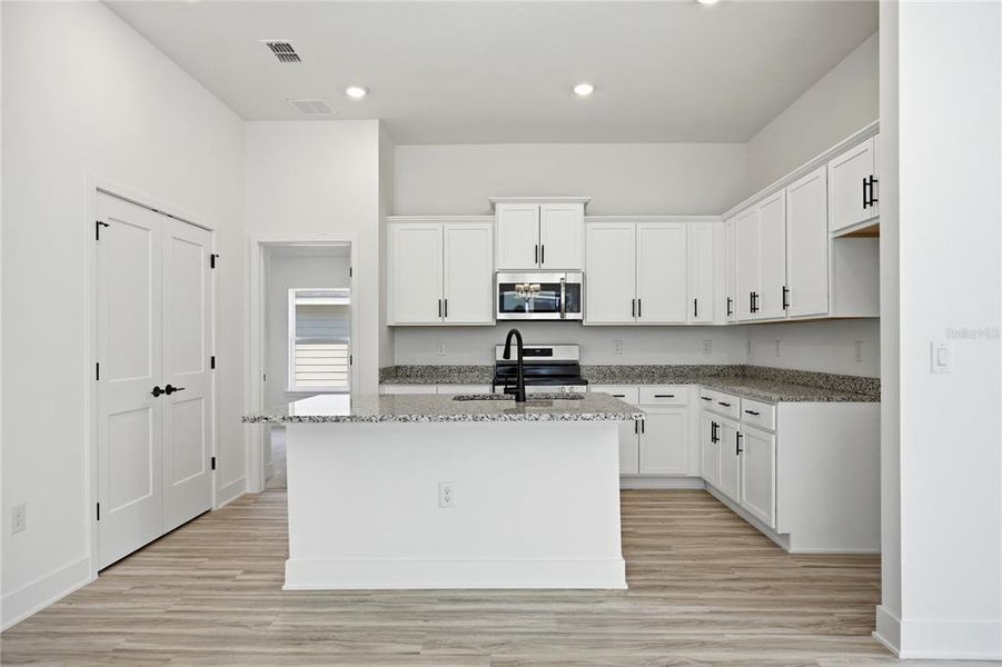 Furnished interior view inside a new home in Briarwood, Alachua (Image 3).