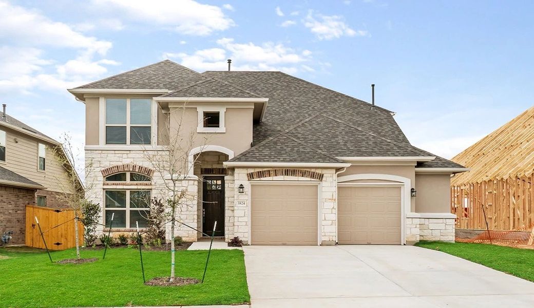 Representative exterior photo of a completed home built from the Thornton by Ashton Woods in Lagos Reserve, Manor, TX (Image 13). Representative exterior photo of a completed home built from the Thornton by Ashton Woods in Lagos Reserve, Manor, TX (Image 13).