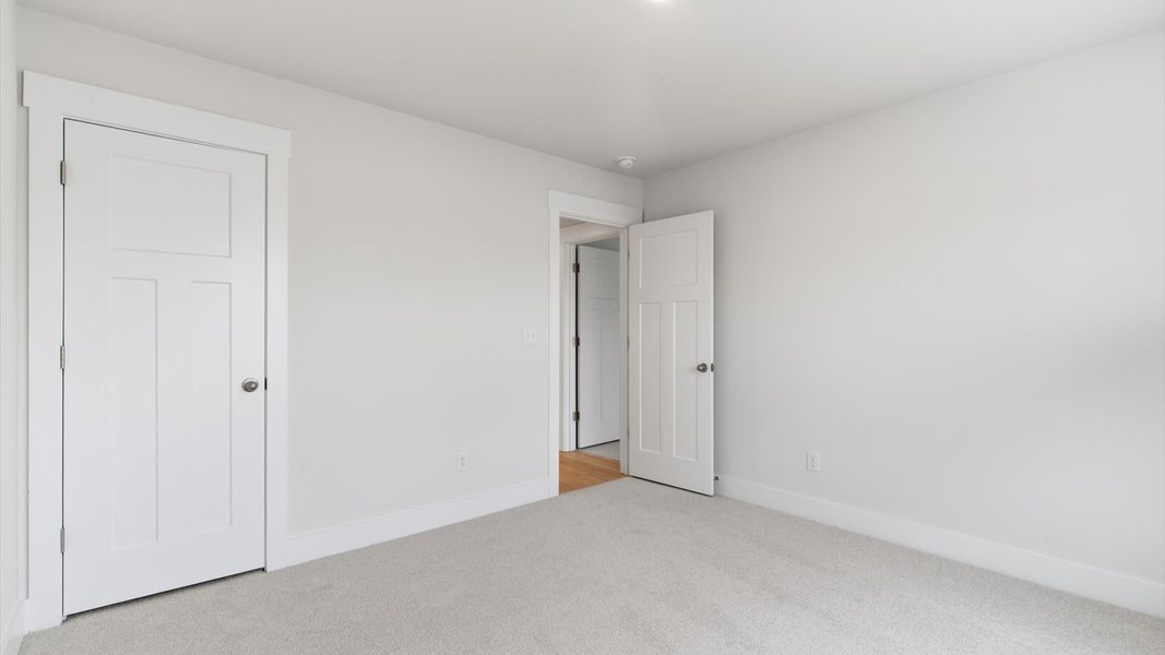 Well-designed space offering plush carpet underfoot and a thoughtfully planned walk-in closet in Greenville, SC