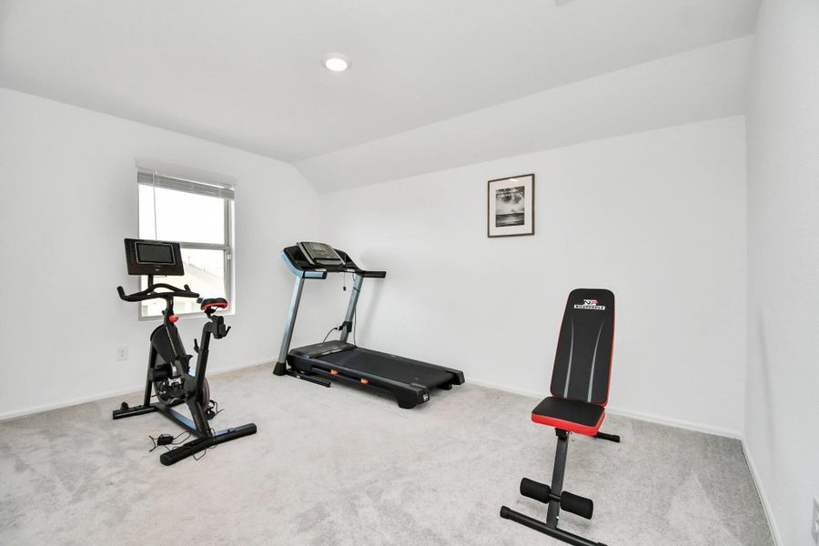 Another bedroom staged as a home gym.