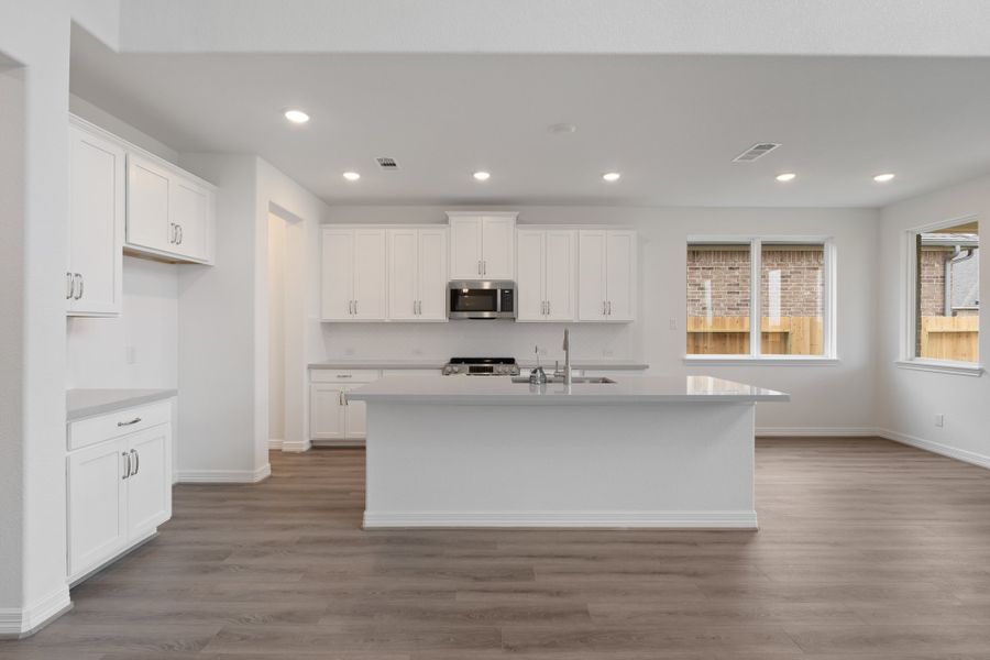 Kitchen and breakfast nook. Note: Sample product photo - actual exterior and interior selections may vary by homesite