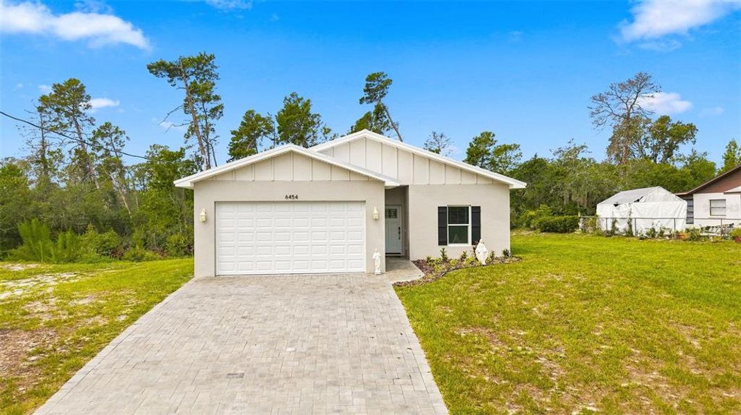 Front exterior of a new home in , Spring Hill, FL, highlighting curb appeal (Image 23).