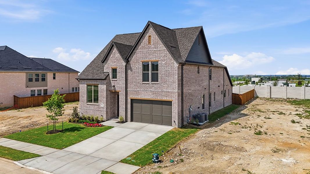 Front exterior of a new home in Hillside Village, Celina, TX, highlighting curb appeal (Image 24). Front exterior of a new home in Hillside Village, Celina, TX, highlighting curb appeal (Image 24).